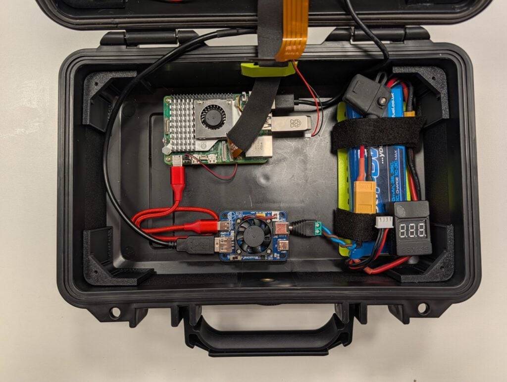 Cyberdeck in an open protective case with its built-in display and keyboard.